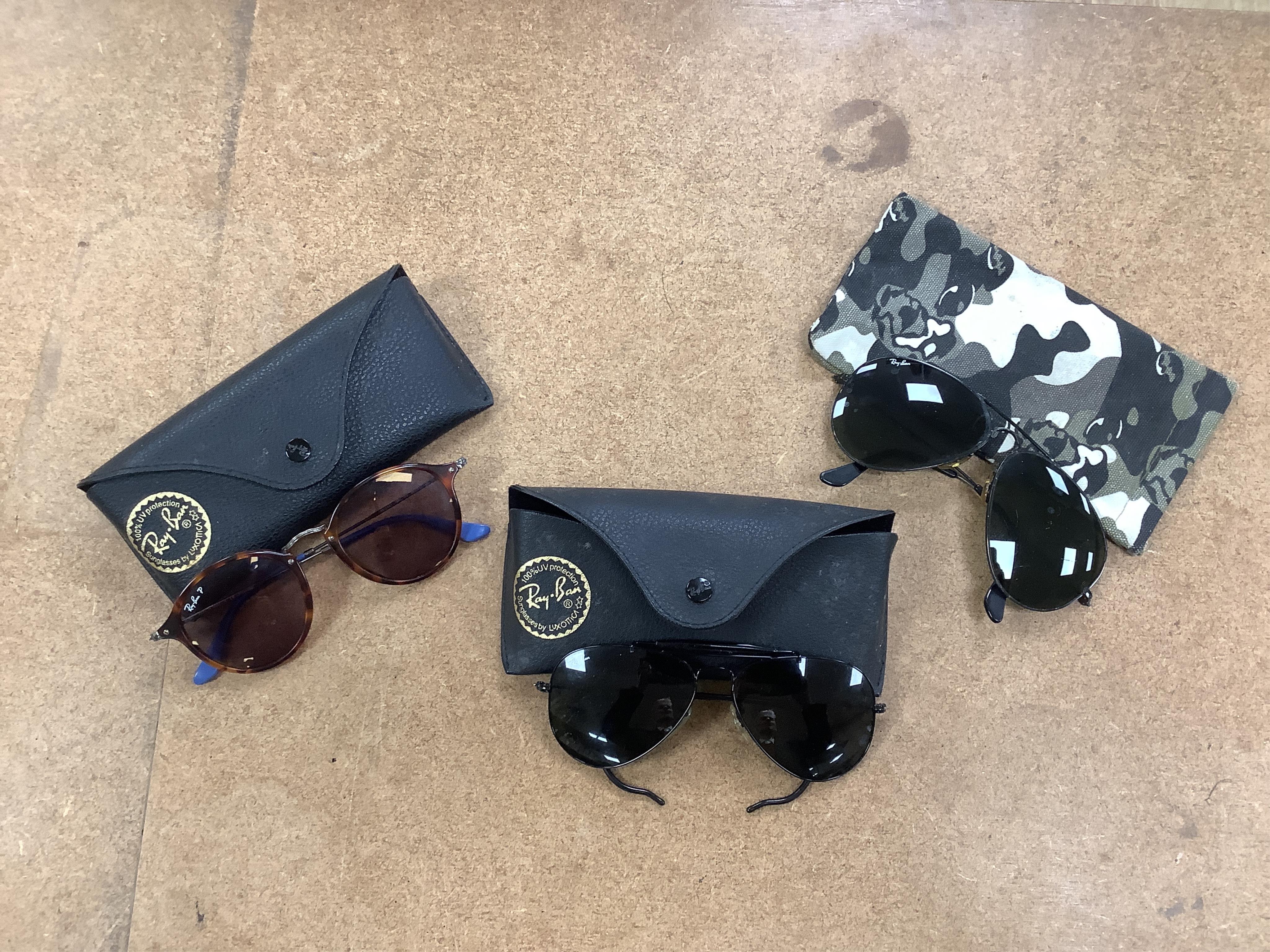 A collection of vintage Ray-Bans and other sunglasses